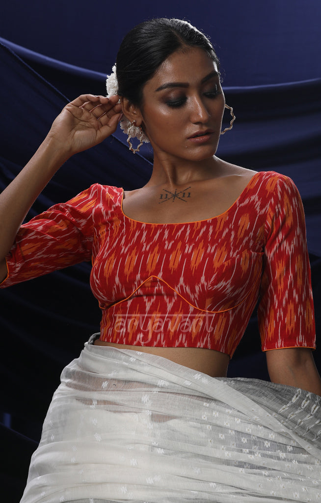 An Ikkat Blouse in a Stunning Combination of Red Orange