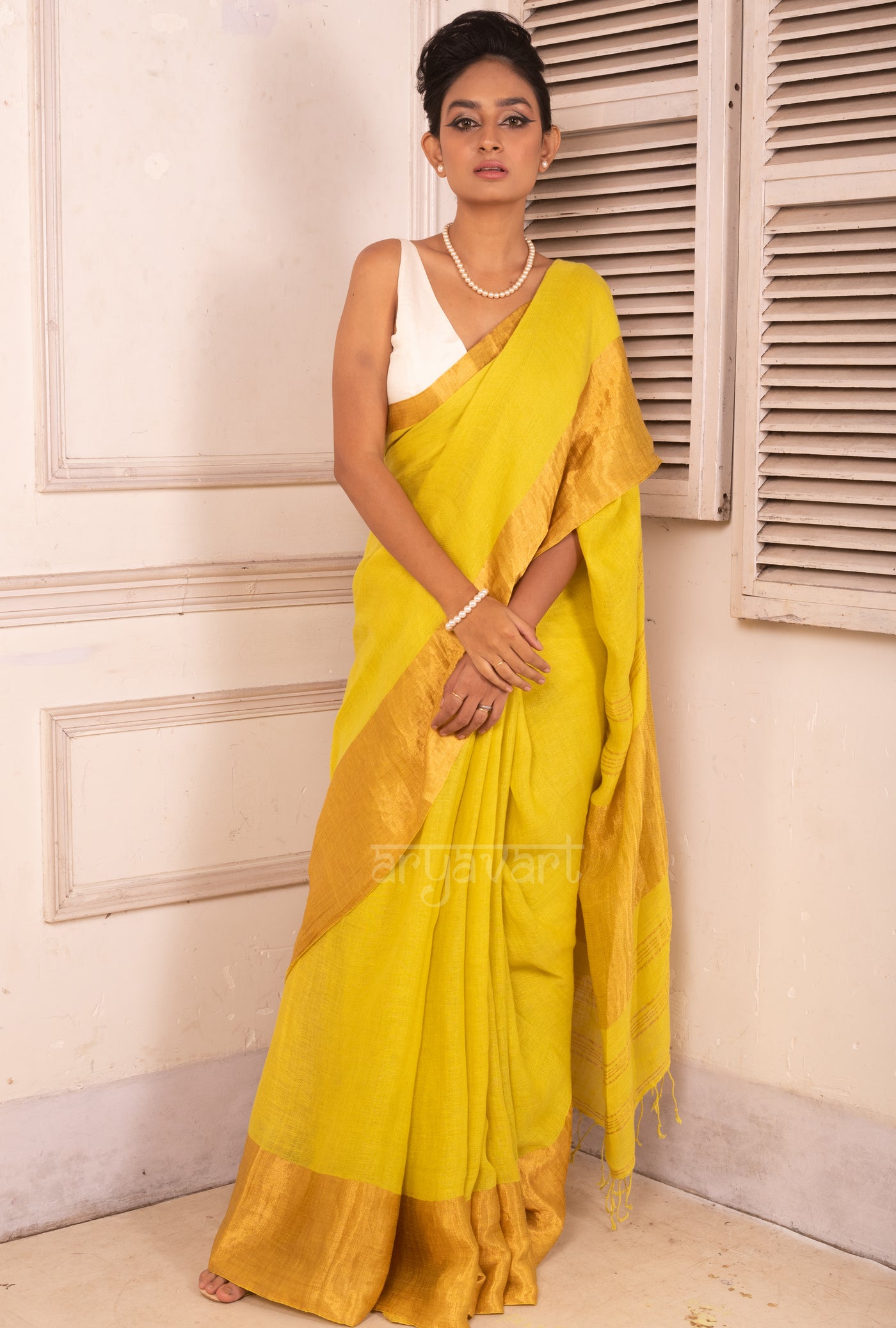 Lime Yellow Linen Saree with a Striking Zari Border & pallu