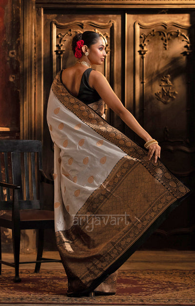 Striking White Katan Silk Saree With A Black Border & Gold Buttas