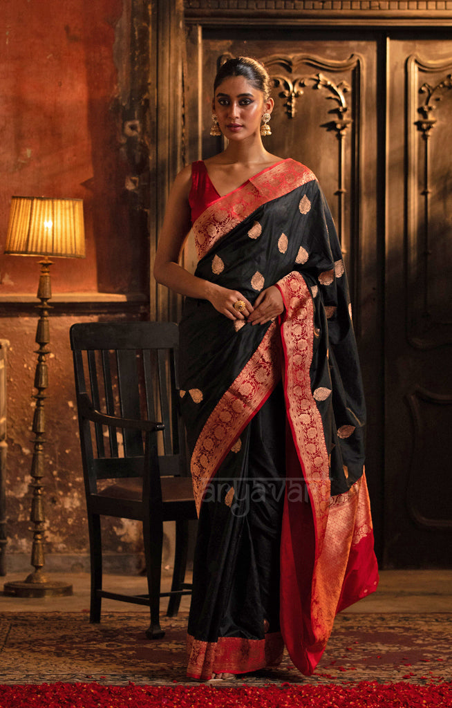 Stunning Black Katan Silk Saree With A Red Border & Gold Buttas