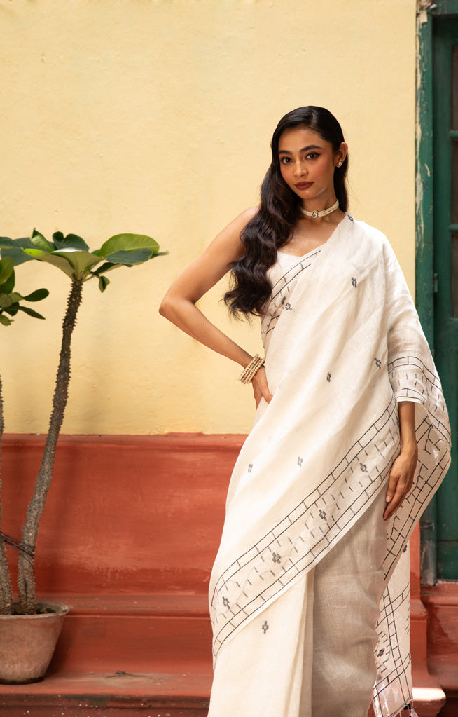 White Linen Saree With Geometric Jamdani Work along the border and on the Pallu