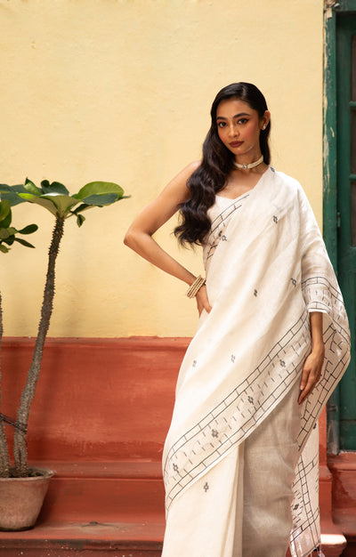 White Linen Saree With Geometric Jamdani Work along the border and on the Pallu