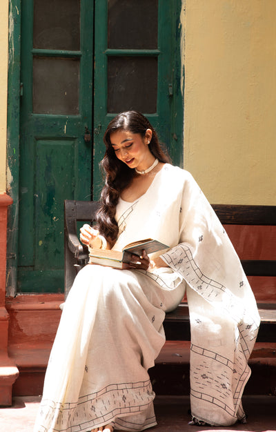 White Linen Saree With Geometric Jamdani Work along the border and on the Pallu