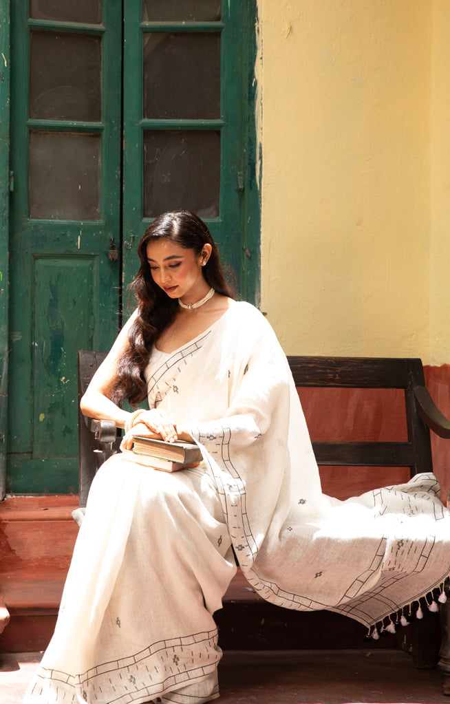White Linen Saree With Geometric Jamdani Work along the border and on the Pallu