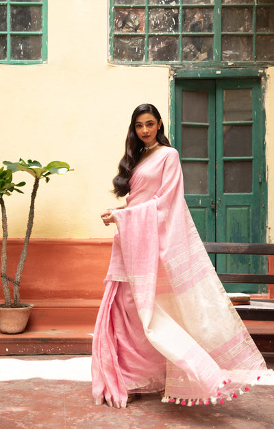 Blush Pink Linen Saree With A Delicate Silver Zari Border