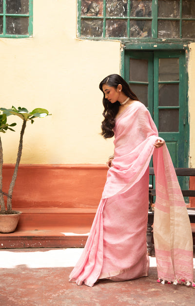 Blush Pink Linen Saree With A Delicate Silver Zari Border