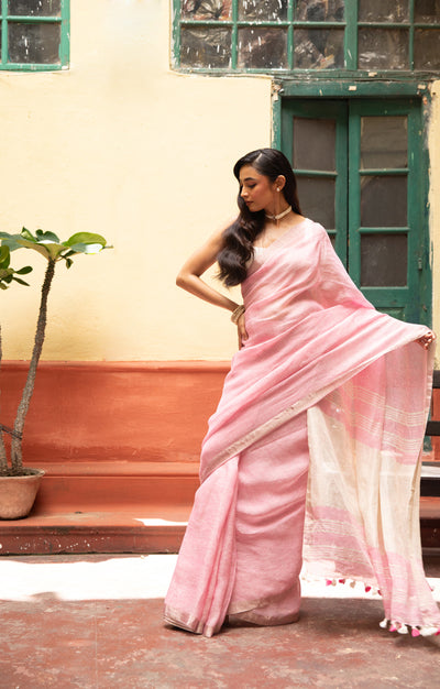 Blush Pink Linen Saree With A Delicate Silver Zari Border