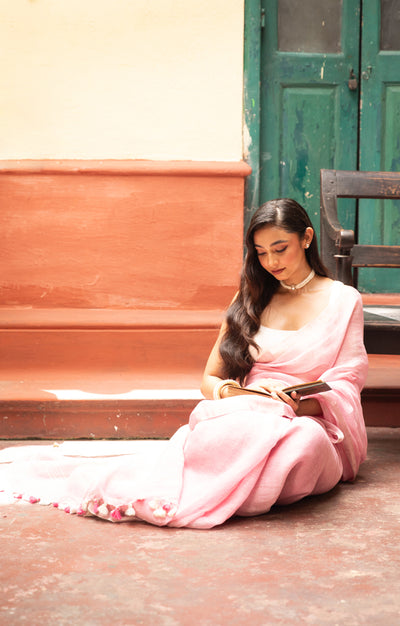 Blush Pink Linen Saree With A Delicate Silver Zari Border