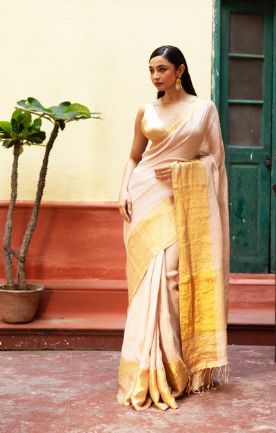 Coral Blossom Textured Linen Saree With A Striking Gold Zari Border & Pallu