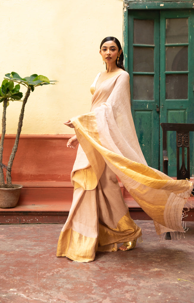 Coral Blossom Textured Linen Saree With A Striking Gold Zari Border & Pallu