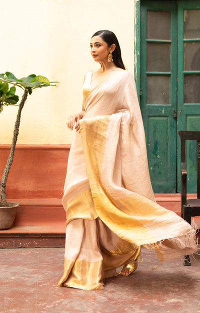 Coral Blossom Textured Linen Saree With A Striking Gold Zari Border & Pallu