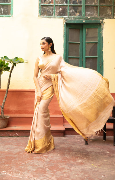Coral Blossom Textured Linen Saree With A Striking Gold Zari Border & Pallu