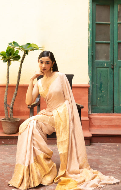 Coral Blossom Textured Linen Saree With A Striking Gold Zari Border & Pallu