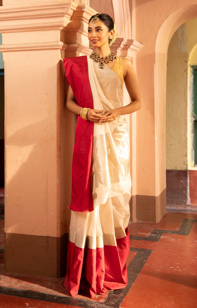 Pearl White Chanderi Saree with a striking Red Border