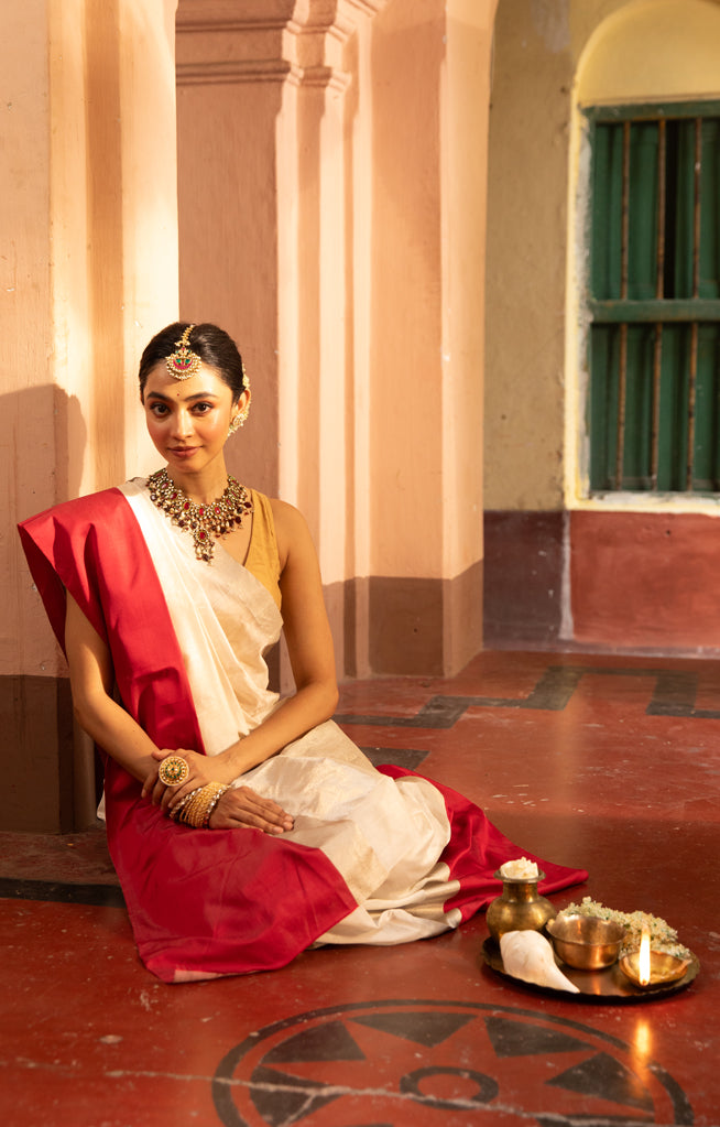 Pearl White Chanderi Saree with a striking Red Border
