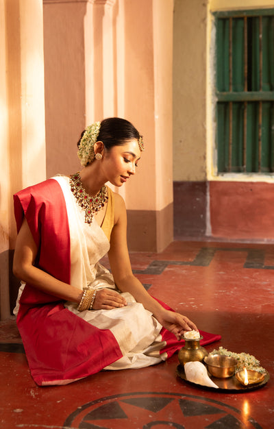 Pearl White Chanderi Saree with a striking Red Border