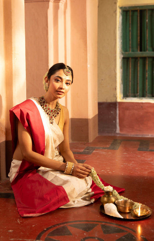 Pearl White Chanderi Saree with a striking Red Border
