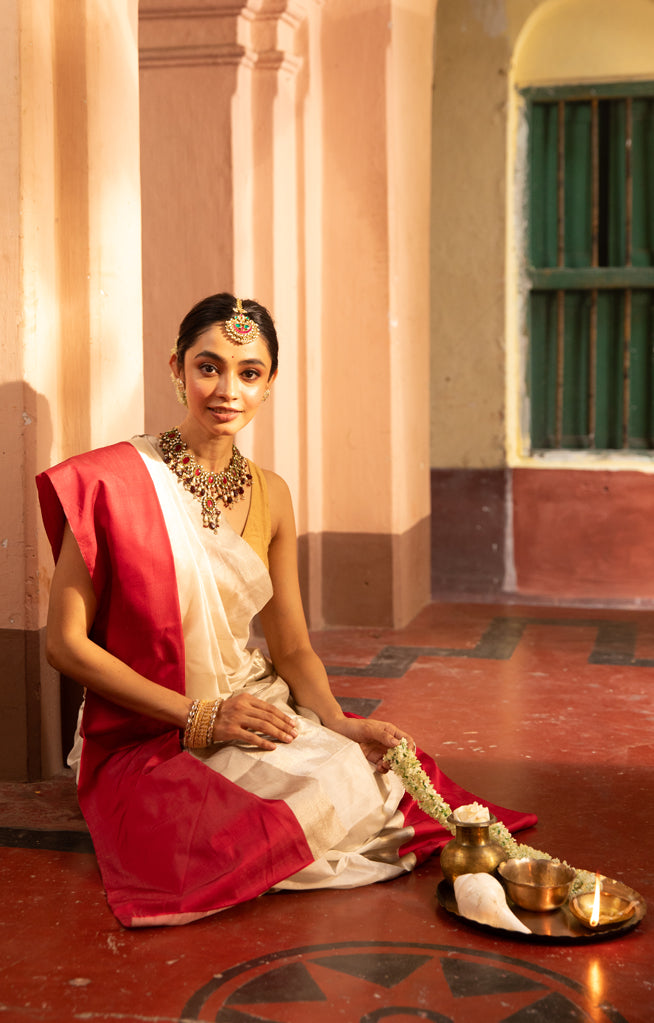 Pearl White Chanderi Saree with a striking Red Border