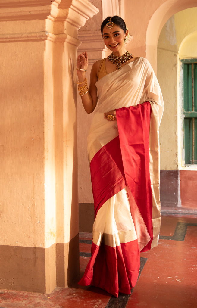 Pearl White Chanderi Saree with a striking Red Border