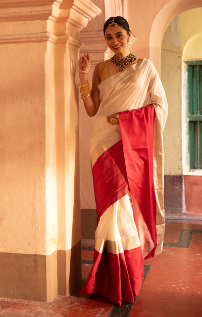 Pearl White Chanderi Saree with a striking Red Border