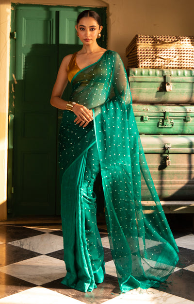 A Vibrant Teal Matka Silk Saree With Woven In Shell Sequence