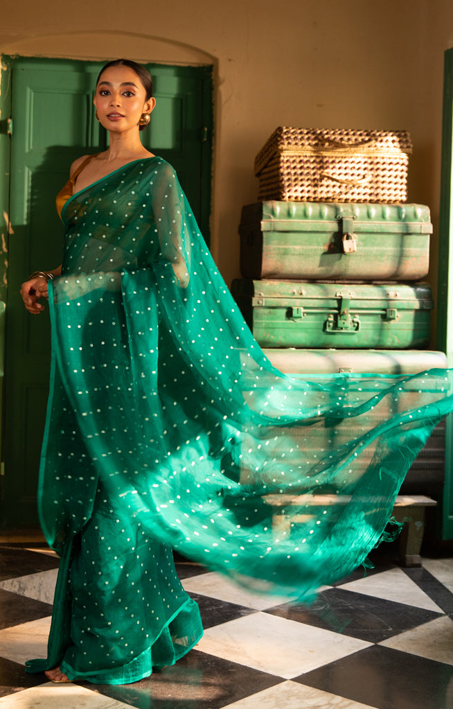 A Vibrant Teal Matka Silk Saree With Woven In Shell Sequence