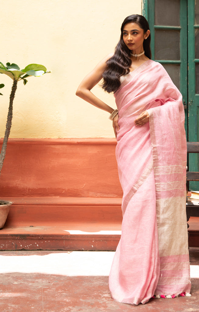 Blush Pink Linen Saree With A Delicate Silver Zari Border
