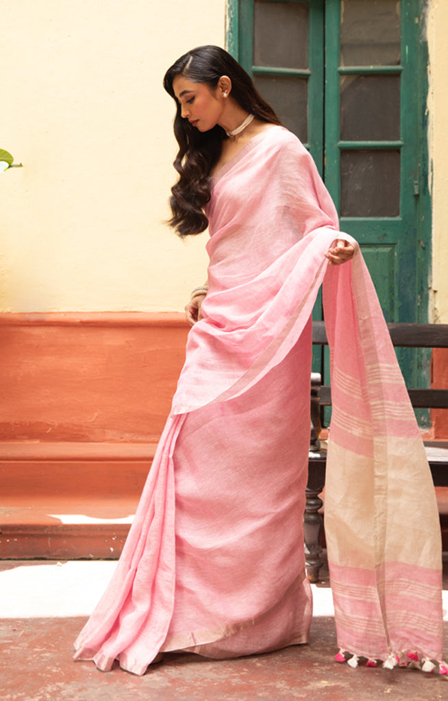 Blush Pink Linen Saree With A Delicate Silver Zari Border