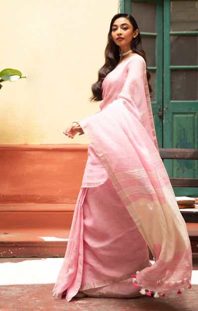 Blush Pink Linen Saree With A Delicate Silver Zari Border