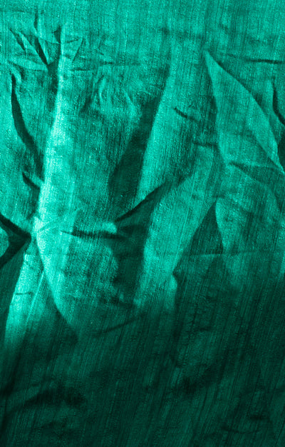 A Vibrant Teal Matka Silk Saree With Woven In Shell Sequence