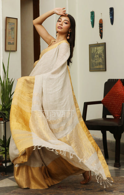Stone White Linen Saree with a striking Zari Border & pallu